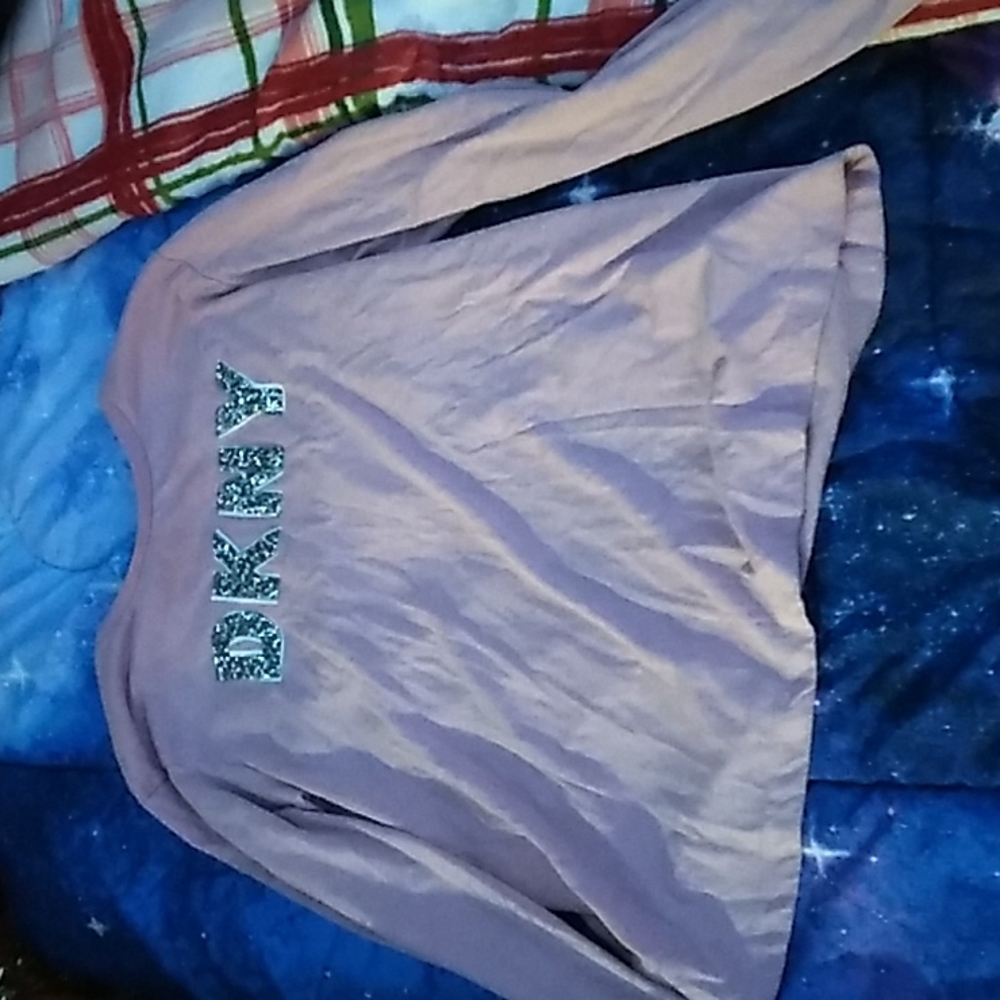 A pink long sleeve dkny shirt